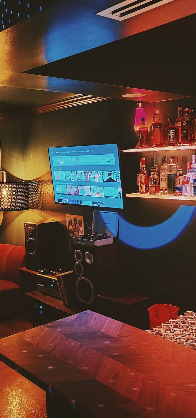 Stylish Living Room event space with sleek TV, ideal for networking and social gatherings.