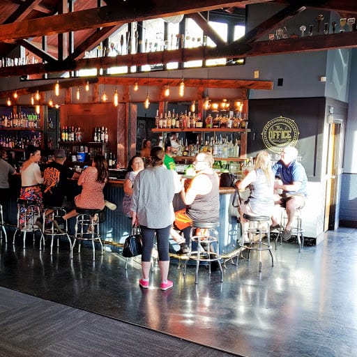 Vibrant bar patio with warm lighting, ideal for networking events and gatherings.