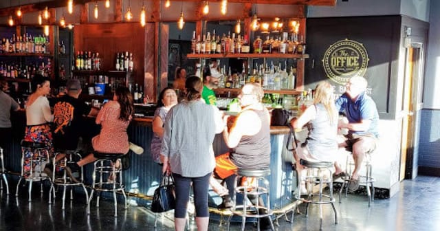Vibrant bar scene at The Office Cocktail Lounge, perfect for networking events and gatherings.