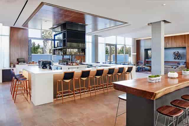 Modern AC Kitchen bar area in AC Hotel, perfect for networking events and receptions.
