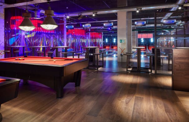 Vibrant Bristol Activity Bar with pool tables and bowling lanes for events and gatherings.