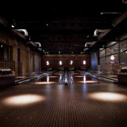 Stylish bowling alley at Newcastle Activity Bar, perfect for corporate events and team-building. - Banner