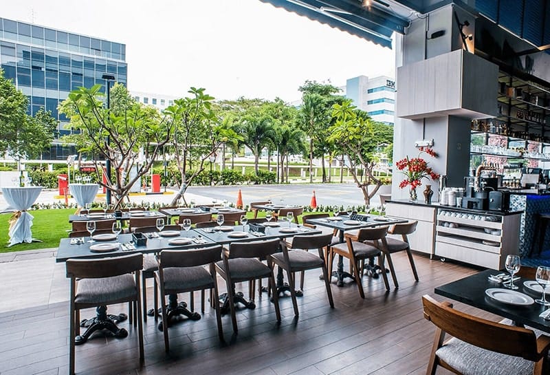 Modern dining area at PEN & INC NTU, perfect for corporate events and gatherings.