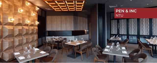 Modern dining space at PEN & INC NTU, perfect for intimate meetings and events.