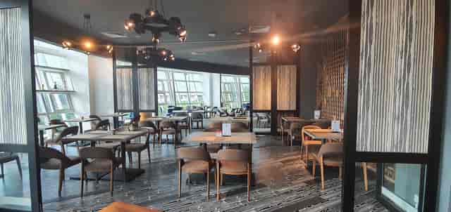 Modern dining space at PEN & INC NTU, ideal for networking events and meetings.