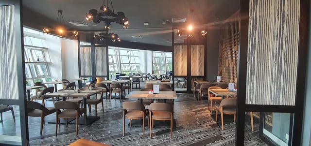 Modern dining space at PEN & INC NTU, ideal for networking events and meetings.