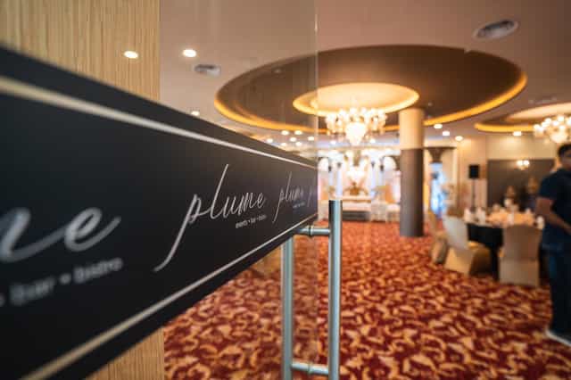 Elegant ballroom in Plume SG with plush seating for upscale events and celebrations.