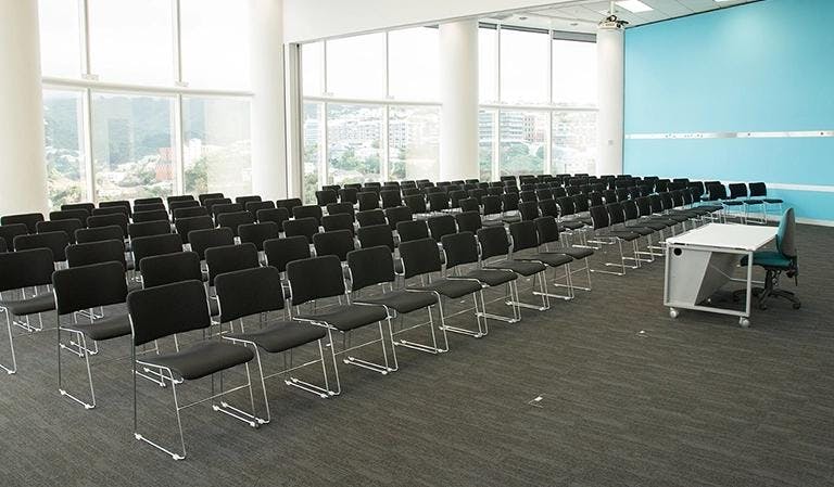 Meeting room in Cliftons Singapore with black chairs, ideal for seminars and workshops.