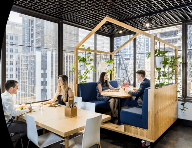 Modern dining space with stylish booths for meetings in Cliftons Singapore.