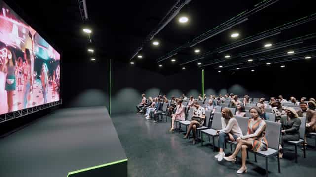 Modern event space with large screen, ideal for conferences and corporate events.