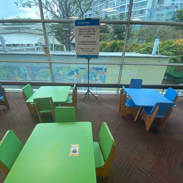 Colorful study tables in Jurong West Public Library for workshops and collaboration.