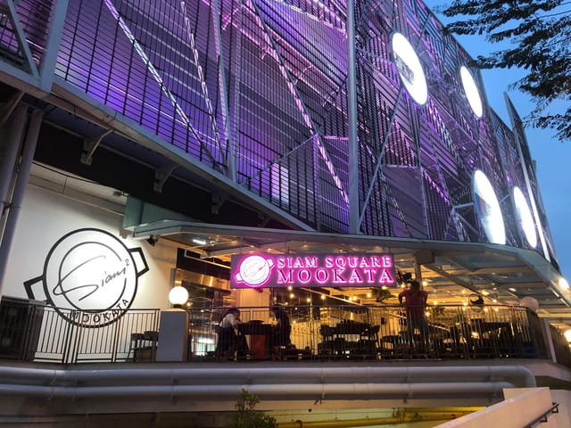 Vibrant Siam Square Mookata dining venue with outdoor seating for casual events.