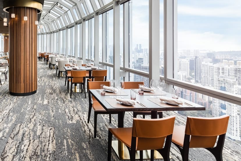 Sophisticated dining space with city views for corporate events and private dinners.