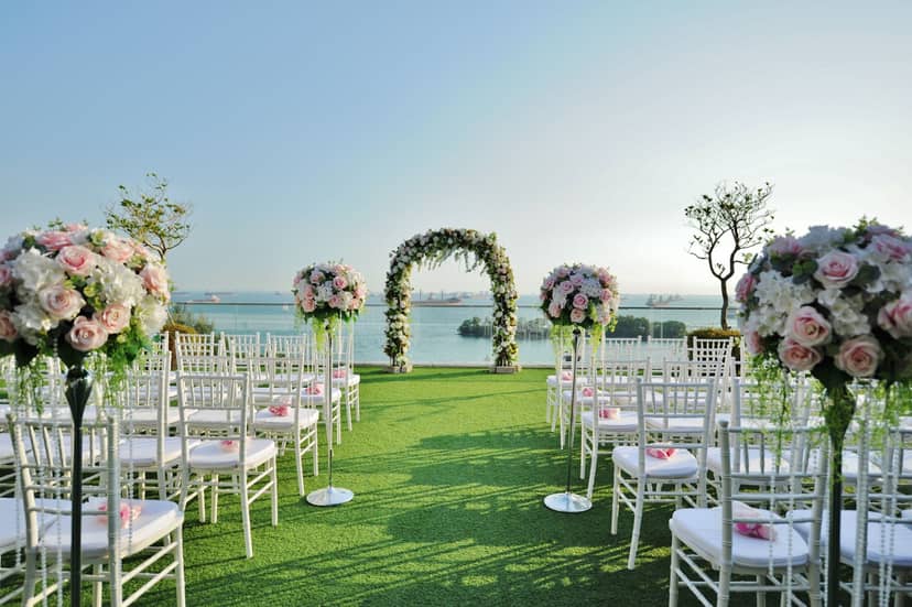 Outdoor wedding venue at Sky Garden Sentosa with floral arch and lush greenery.