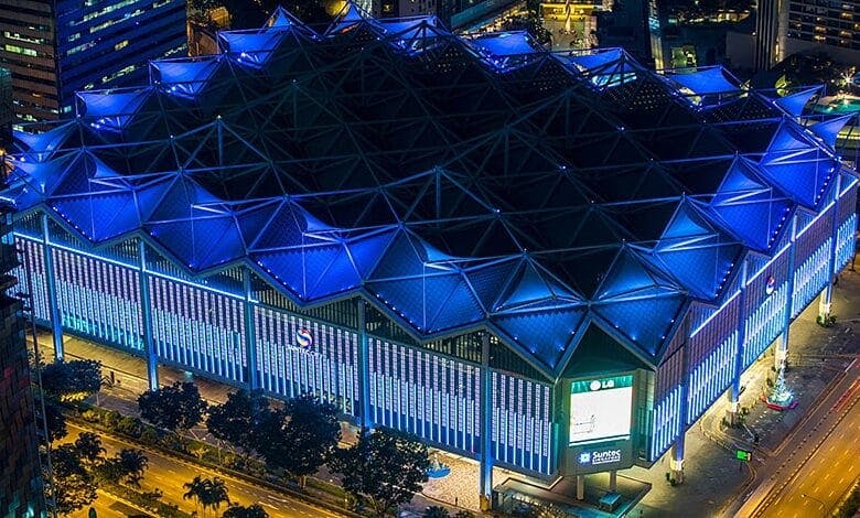 Modern event venue at Suntec Singapore, illuminated in blue for conferences and exhibitions.