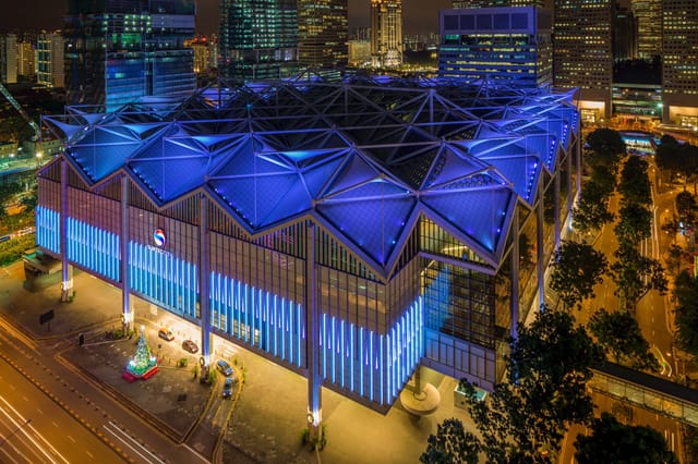 SNEF Event at Suntec Singapore, modern convention center with blue lighting, ideal for conferences.