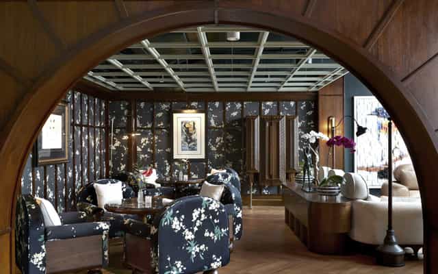Podcast Room at Mandala Club with floral furniture, ideal for corporate events and networking.