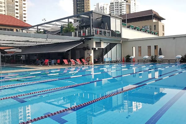 Sleek modern pool at The American Club Singapore, ideal for outdoor events and gatherings.