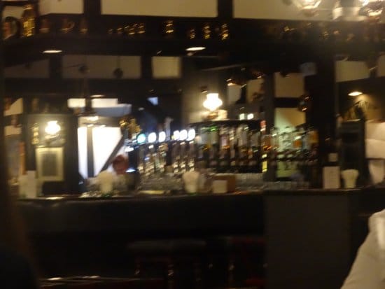 Tavern in Tanglin Club bar with warm lighting, ideal for networking events and gatherings.