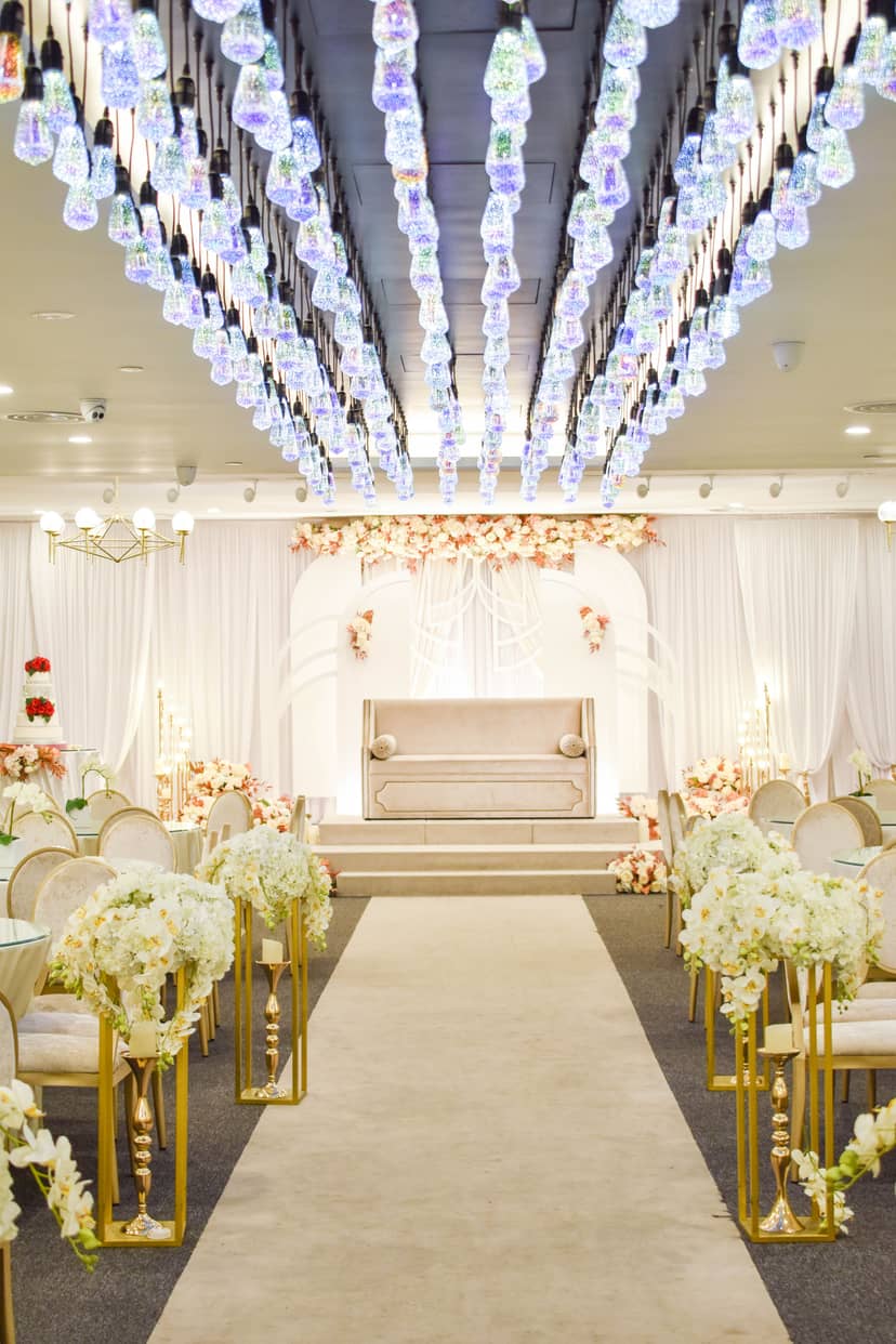 Royal Hall in Lagun Sari Singapore, elegant wedding venue with floral decor and stage.
