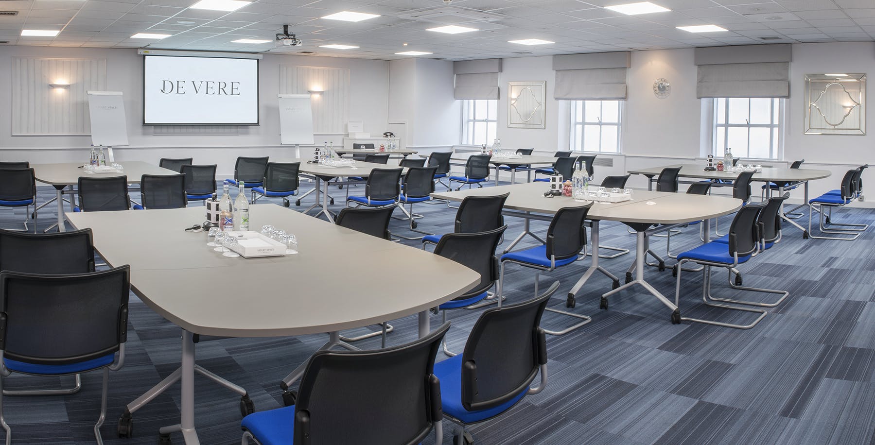 Dorset Suite meeting room with flexible tables, ideal for professional events and conferences.