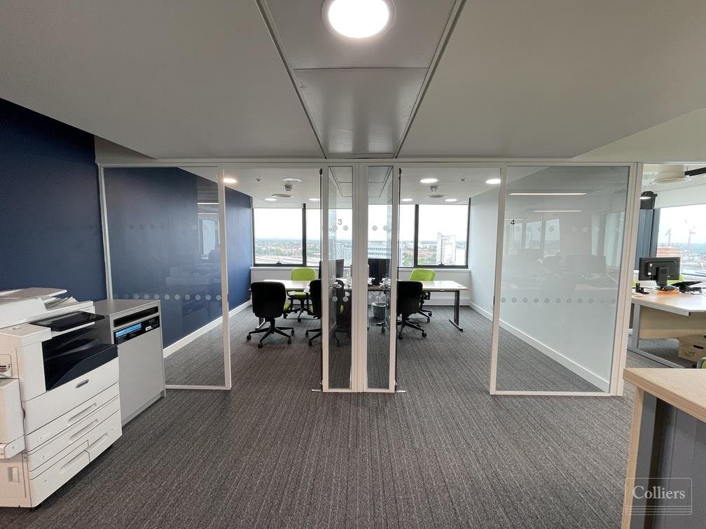 Modern meeting space with glass partitions for collaboration at 111 Piccadilly.