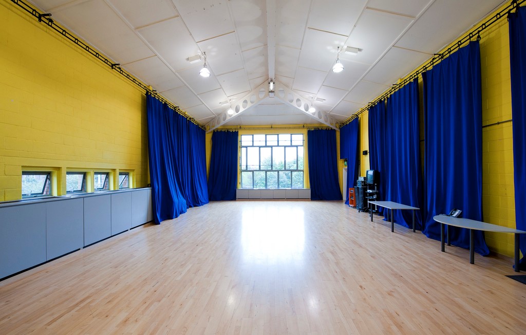 Spacious event room with yellow walls, ideal for workshops in Contact Theatre Manchester. - Banner