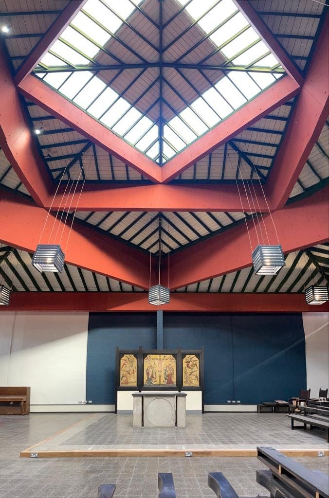 Sanctuary in Ascension Church Hulme, featuring high ceilings and modern lighting for events.