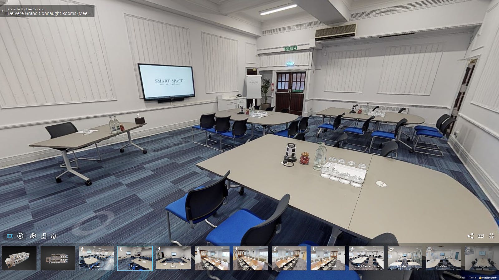 Durham Suite meeting room with large screen, ideal for corporate events and presentations.