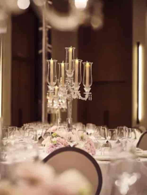Elegant dining table with crystal candelabra in The Lana Ballroom for upscale events.