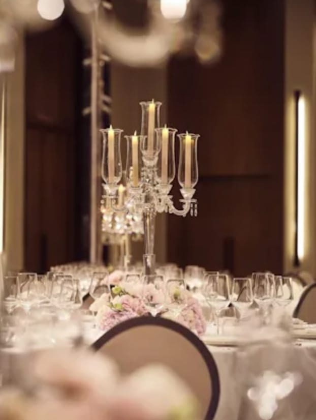 Elegant dining table with crystal candelabra in The Lana Ballroom for upscale events.