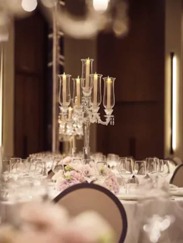 Elegant dining table with crystal candelabra in The Lana Ballroom for upscale events.