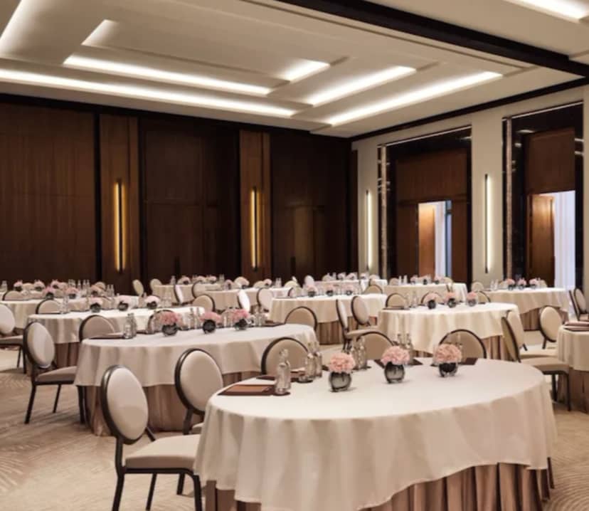Elegant Lana Ballroom with floral centerpieces, perfect for corporate events and upscale gatherings.