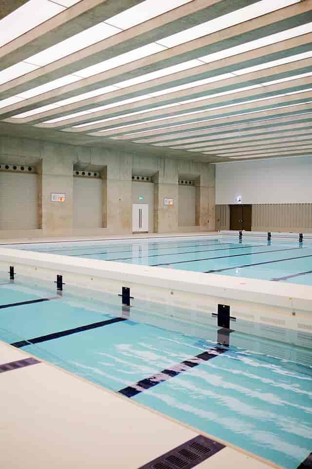 Modern indoor swimming pool at London Aquatics Centre, perfect for aquatic events and training.