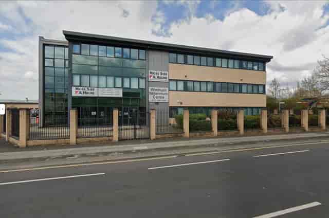 Modern light industrial venue with large windows for corporate events in Moss Side.