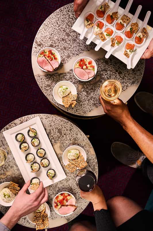 Elegant hors d'oeuvres in The Royal Retiring Room, London Coliseum for events and networking.