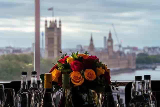 Elegant table with floral centerpiece at Riverview Lounge, London for corporate events.