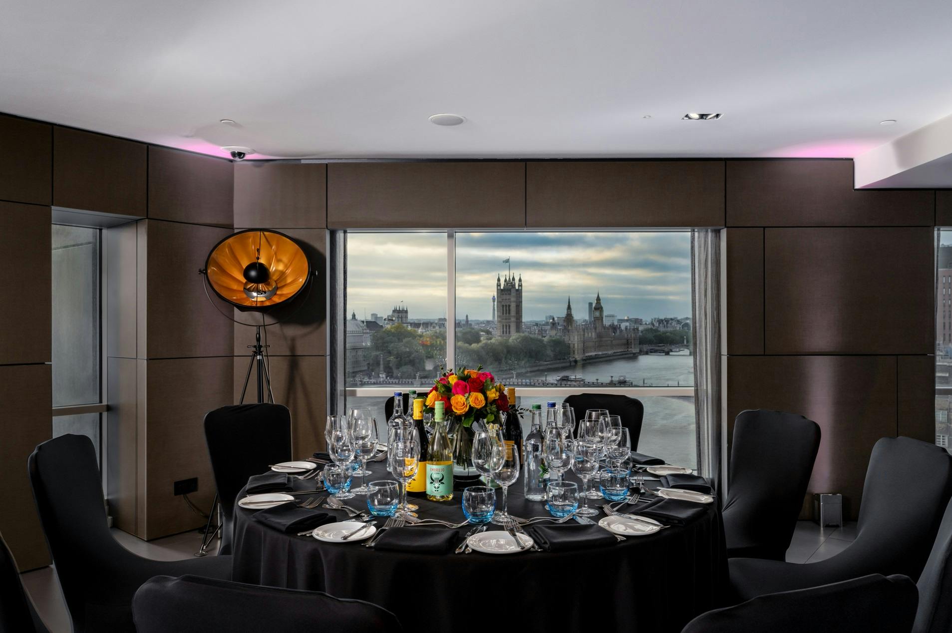 Elegant dinner setup at Riverview Lounge, Park Plaza London Riverbank with floral centerpiece.