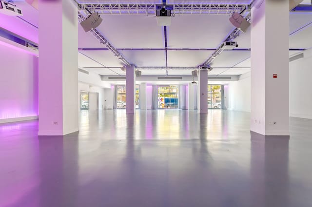 Spacious modern event venue in Midtown NYC with sleek floors and flexible seating.
