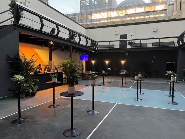 Main Room at Terminal 5 with stylish planters, ideal for networking events and receptions.