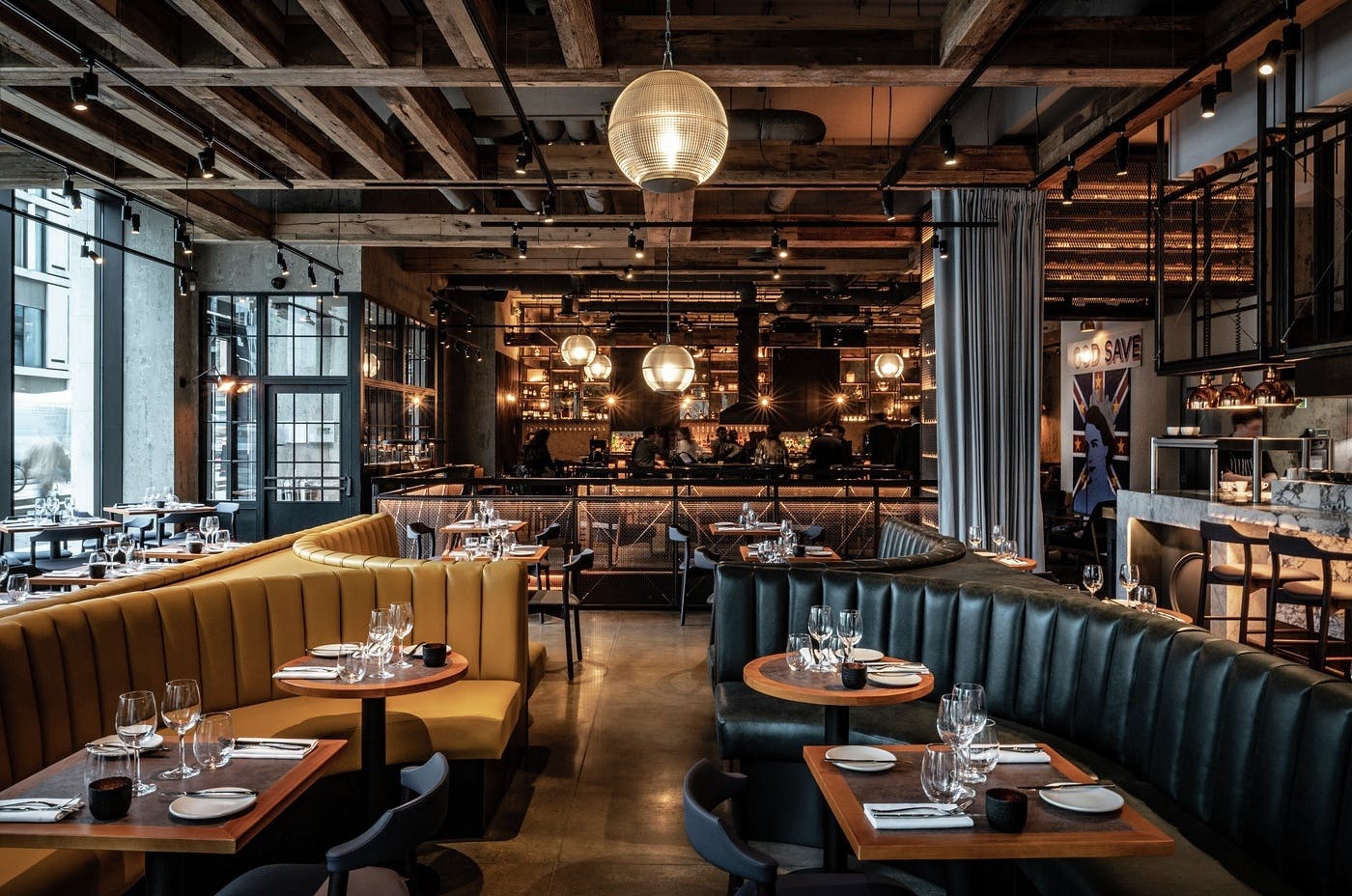 Stylish restaurant interior with cozy booths for events at Bread Street Kitchen.