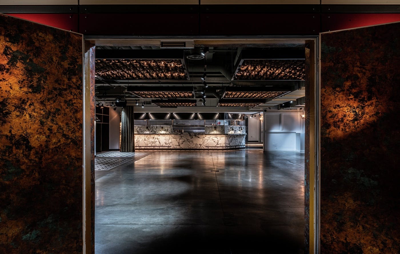 Modern event space at Bread Street Kitchen with sleek bar, ideal for corporate gatherings.