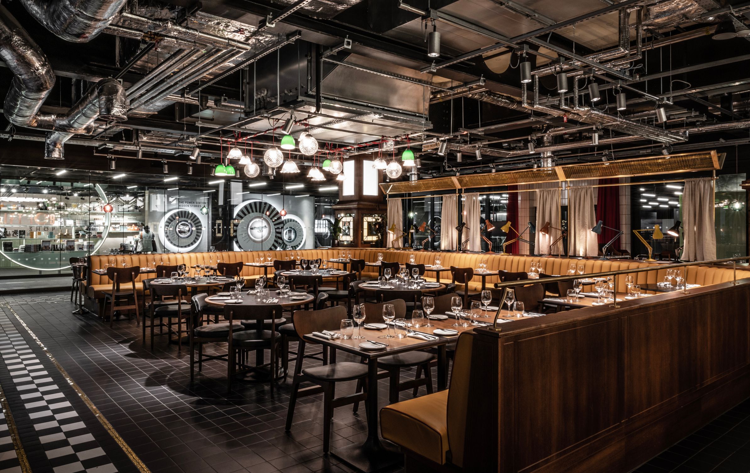 Modern restaurant venue with industrial decor for corporate events and private dinners. - Banner