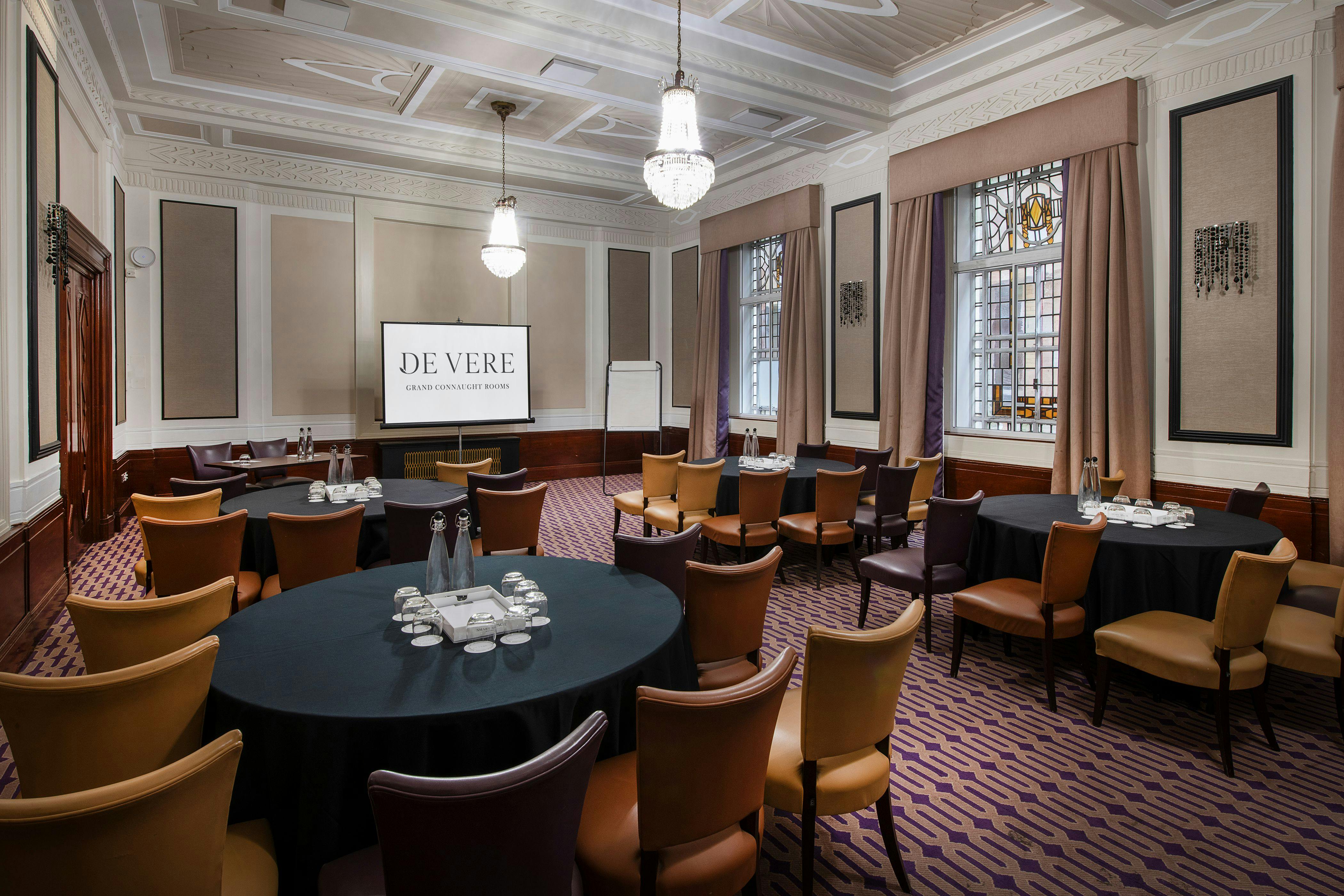 Private dining suite with round tables, ideal for corporate events and workshops.