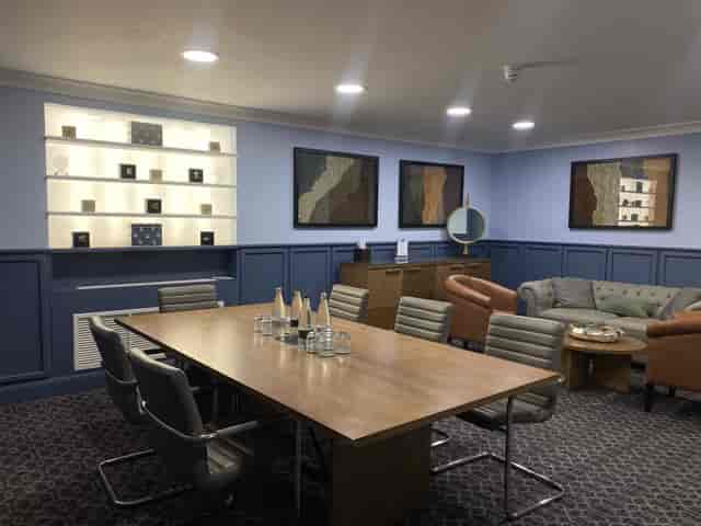 Hospitality Suite at De Vere Grand Connaught Rooms, featuring a sleek conference table.