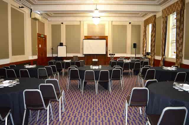 Cambria Suite banquet setup with round tables for corporate training and business conferences.