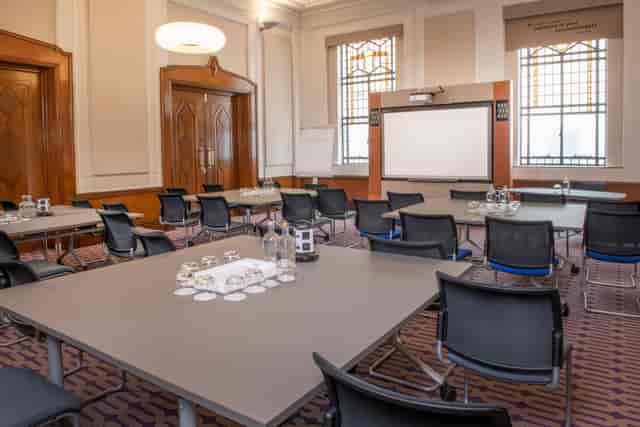 Denbigh Suite meeting room with natural light, ideal for conferences and presentations.