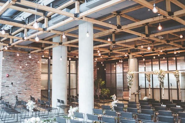 Modern event space with exposed beams, ideal for weddings and corporate events in NYC.