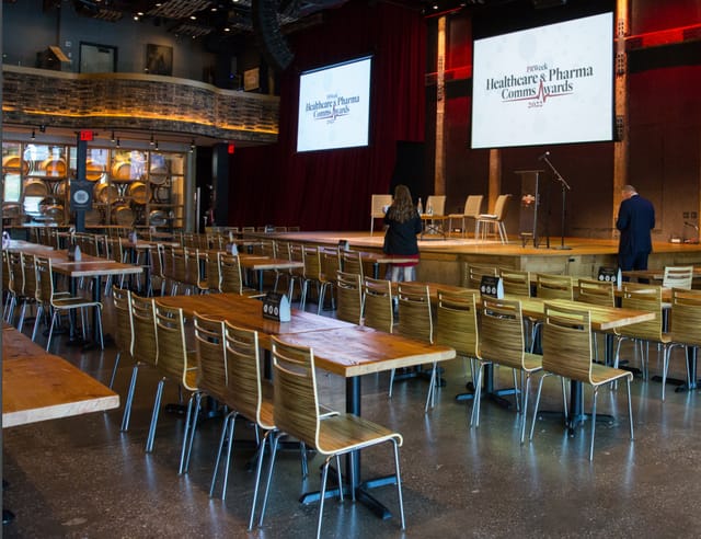 River Level at City Winery NYC, event space for healthcare conference with wooden tables.