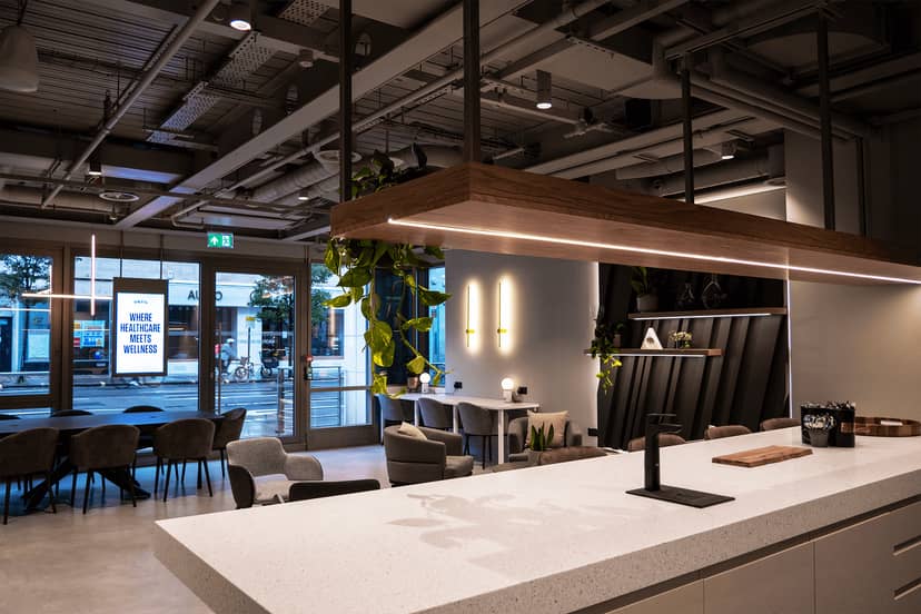Modern event space in UNTIL MaRylebone with sleek reception and greenery for networking.
